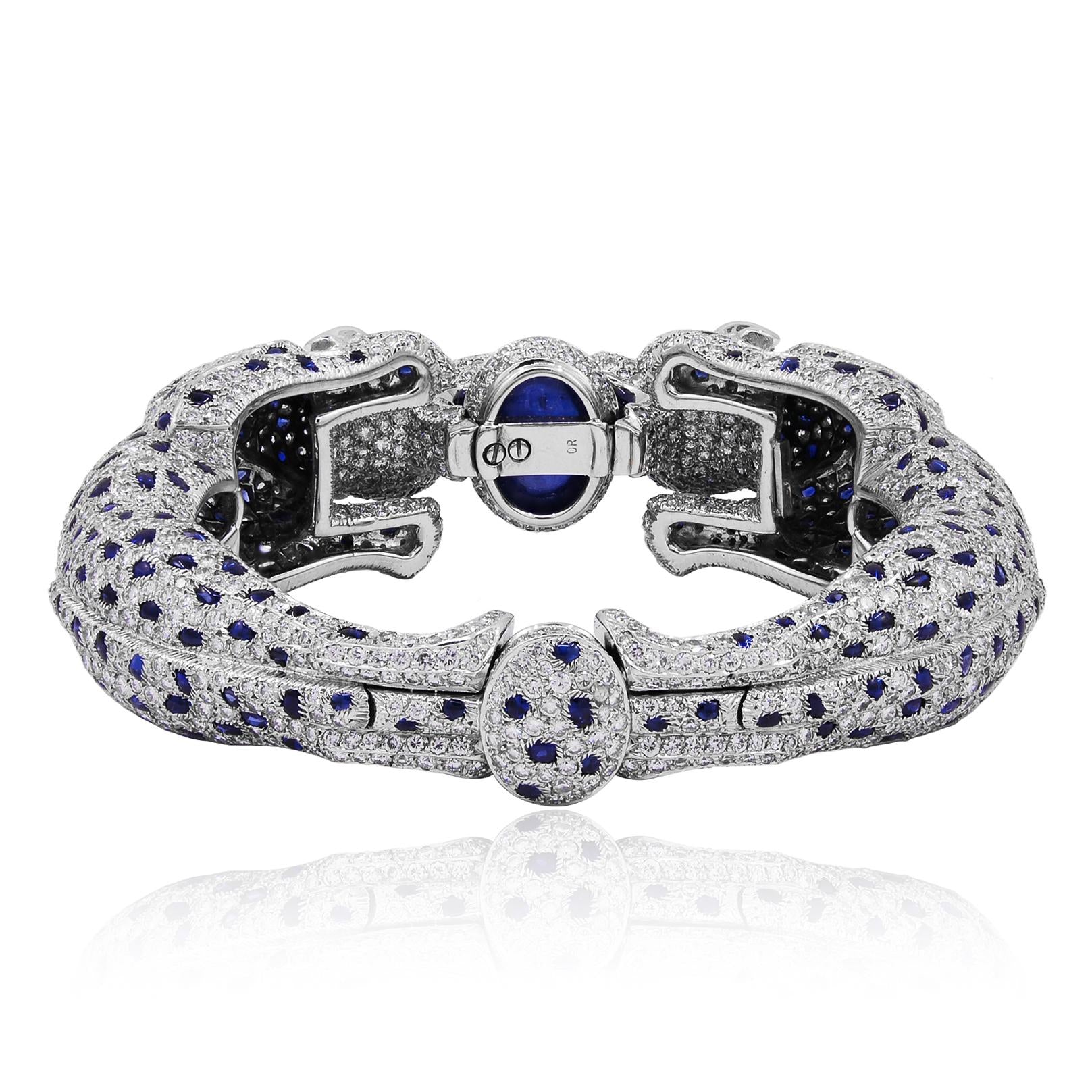 CARTIER Platinum, Diamond and Sapphire Two Panther Head Bangle