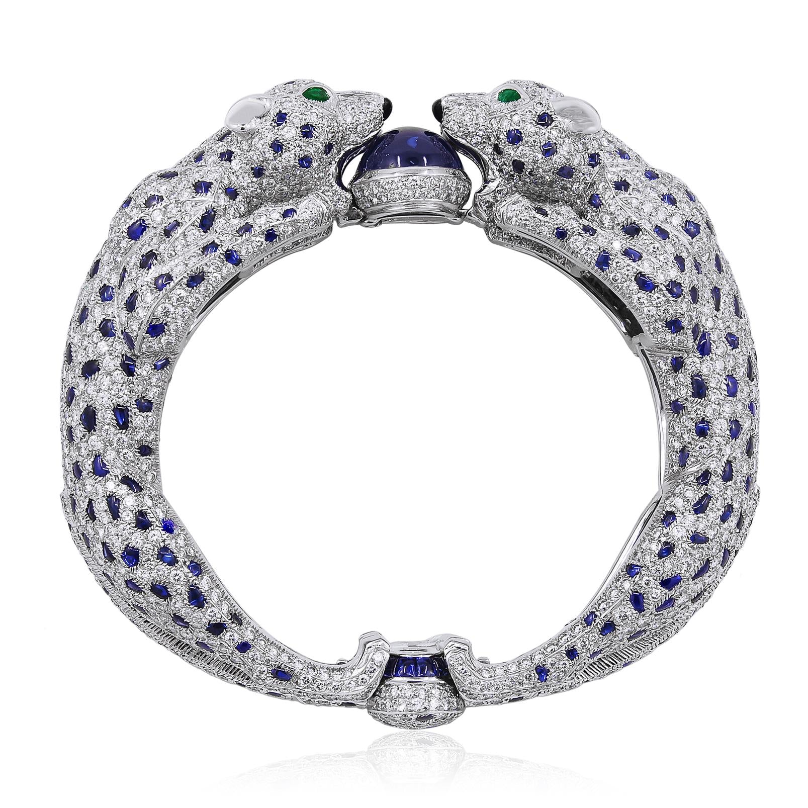 CARTIER Platinum, Diamond and Sapphire Two Panther Head Bangle